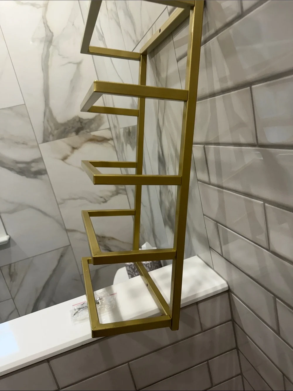 Gold Wall-Mounted Towel Rack with Green and Beige Towels - Modern Bath Storage